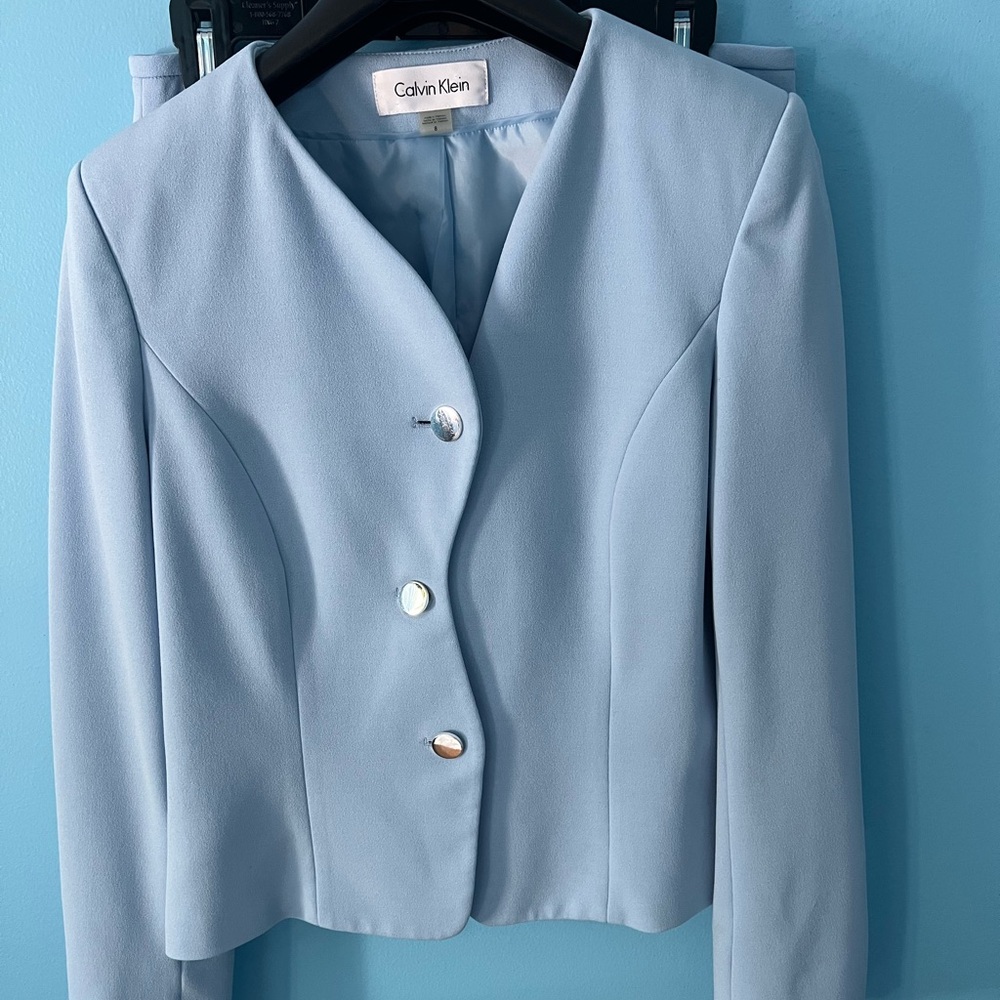Calvin Klein Pale Blue Tailored Button blazer and matching skirt.